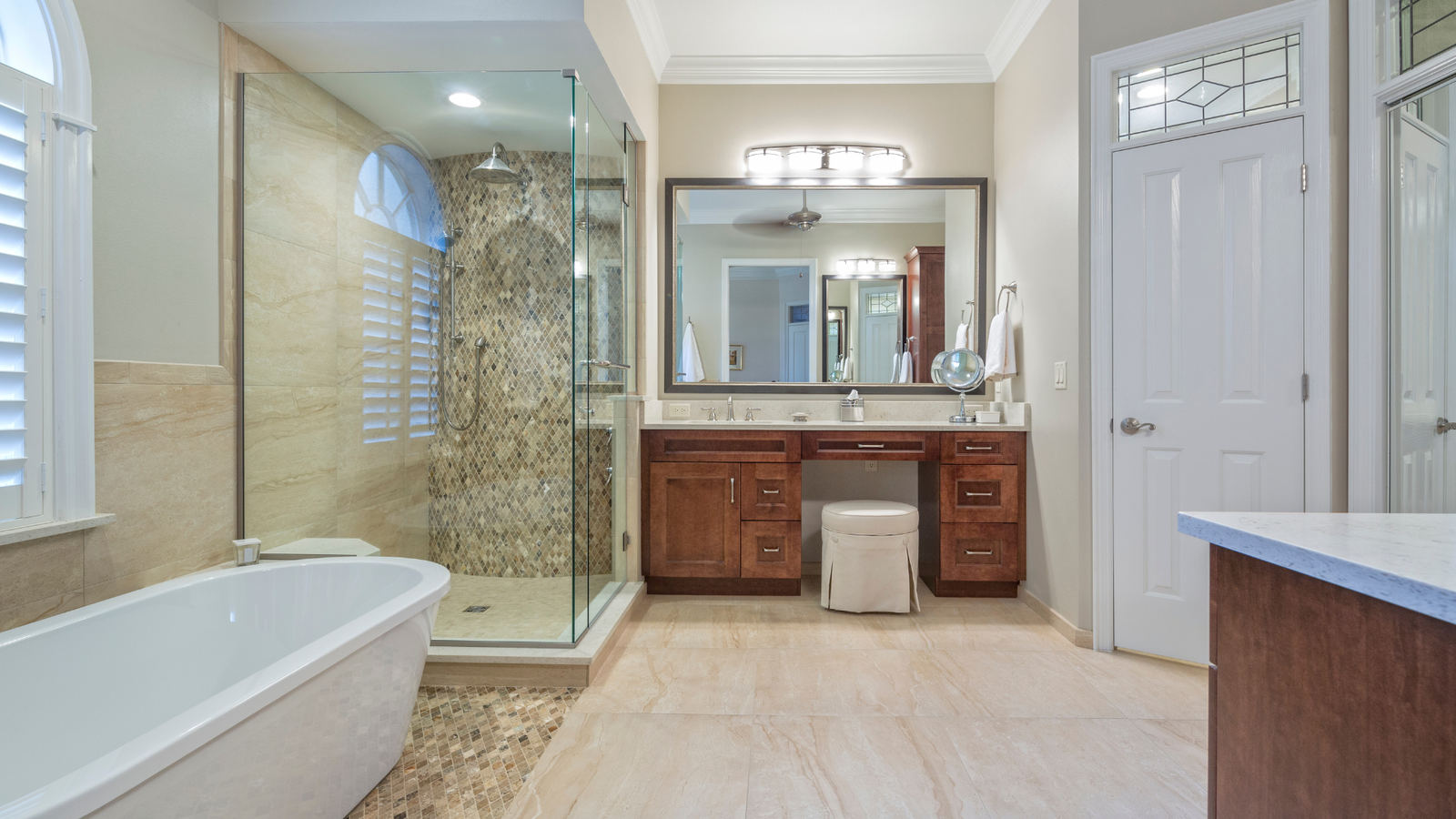Bathroom glass shower with wood vanity