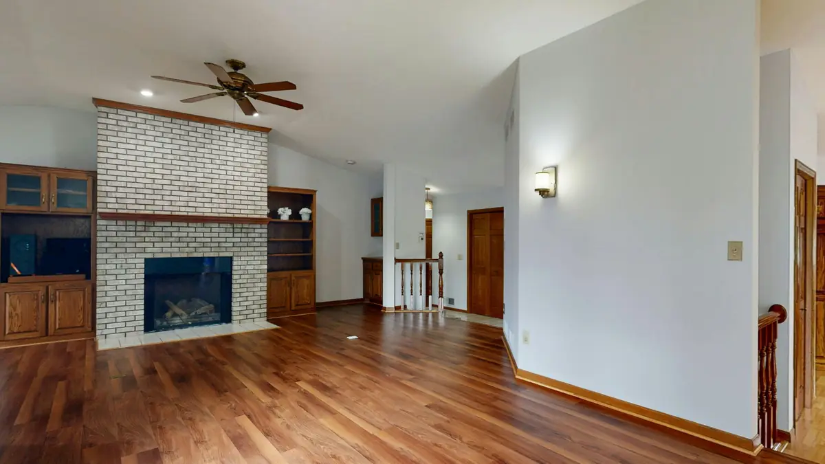 Living room with brick fireplace