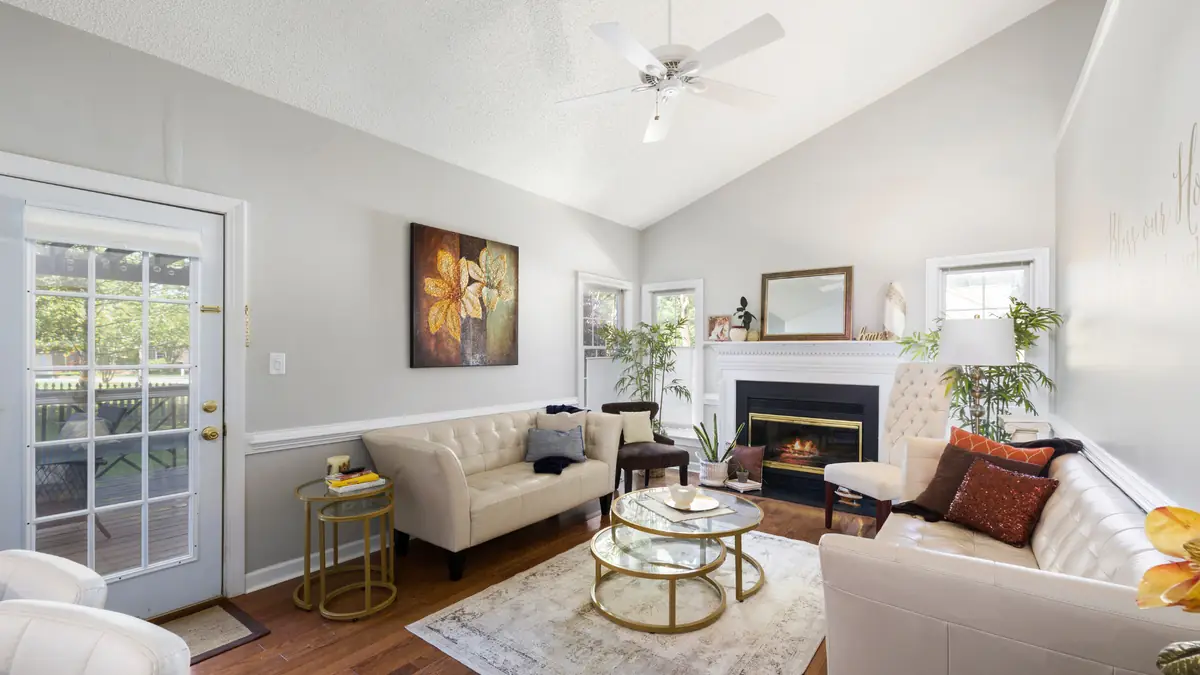 Living room cream sofa and fireplace